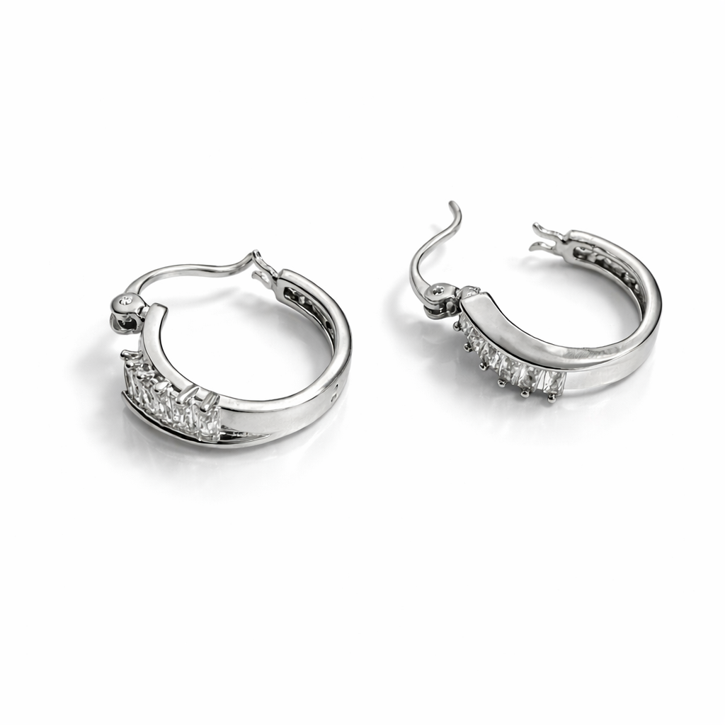 Silver tone huggie hoop earrings with cubic zirconia detail, 1.8 cm height, 5 mm width.