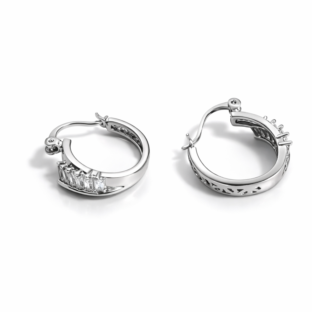 Silver tone huggie hoop earrings with cubic zirconia detail, 1.8 cm height, 5 mm width.