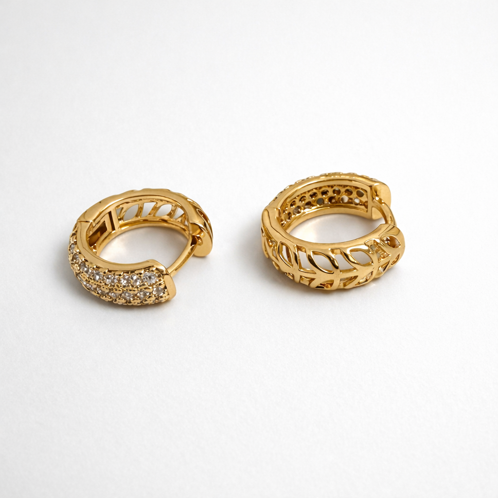 Gold plated full pavé huggie earrings with cubic zirconia, 1.4 cm diameter, 6 mm width.

