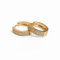 Gold plated pavé huggie hoop earrings with cubic zirconia, 1.7 cm diameter, 4 mm thickness.