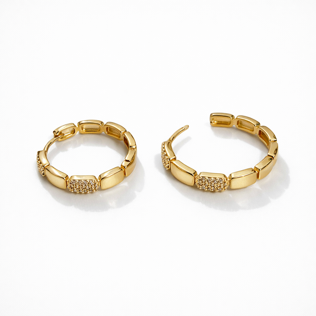 Gold plated segment hoop earrings with cubic zirconia detail, 2.5 cm diameter, 4 mm thickness.
